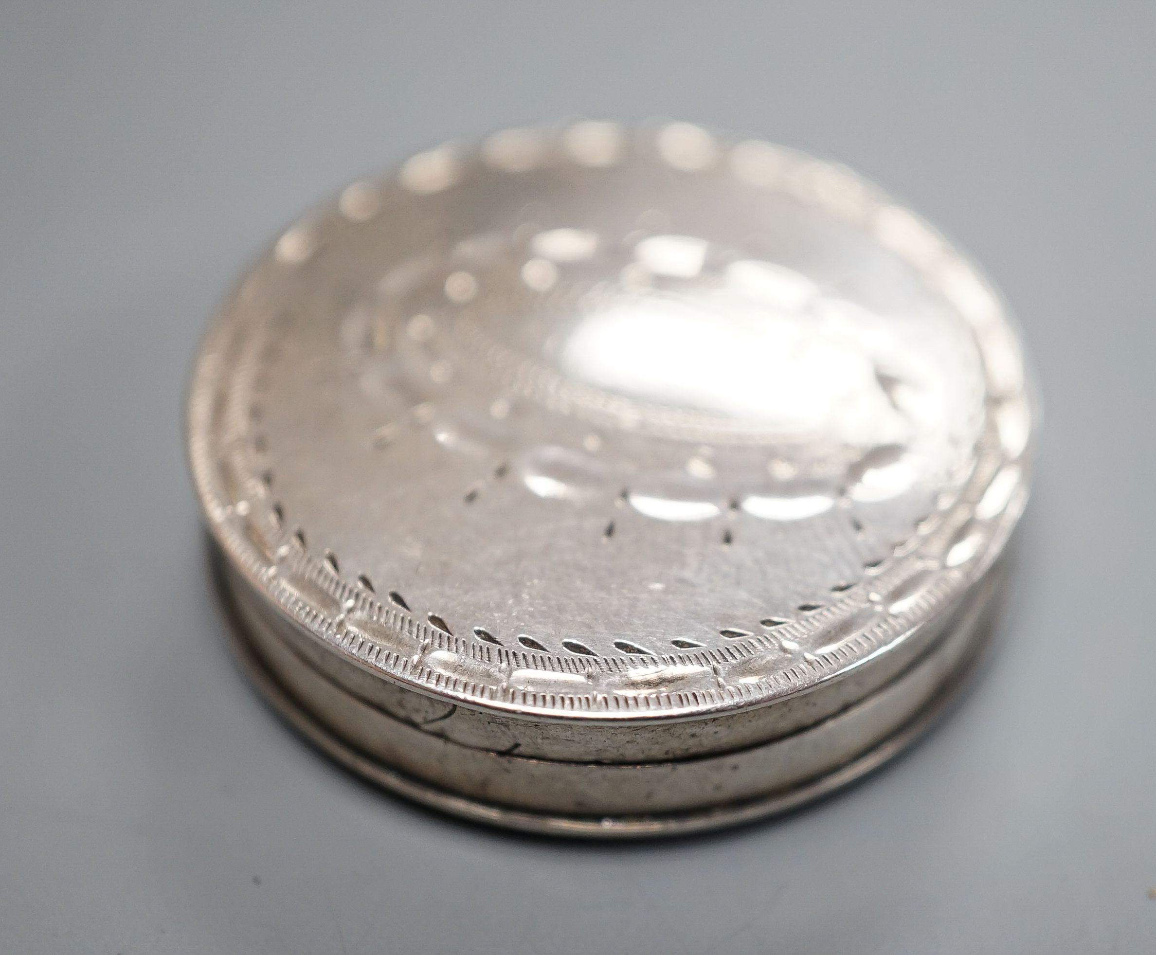 A George III engraved silver pill box, by Samuel Pemberton, Birmingham, 1792, 27mm.